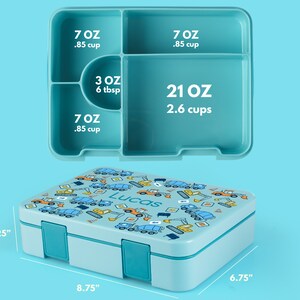 May include: A light blue lunch box with a construction vehicle print and the name "Lucas" on the lid. The lunch box has four compartments with measurements in ounces and cups. The lunch box measures 8.75 inches by 6.75 inches by 2.25 inches.