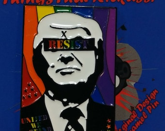 May include: Enamel pin featuring a stylized portrait with the word "RESIST" in rainbow colors covering the eyes. The pin has a rainbow background and the words "UNITED WE STAND". The pin is a "Original Design Enamel Pin".