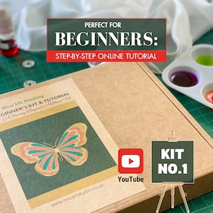 May include: A brown cardboard box with a label that says "Mius Silk Painting Beginner's Kit & Tutorial A Journey Beyond A Basic Kit" and features a colorful butterfly illustration. The box is labeled "Kit No. 1" and has a YouTube logo on it.