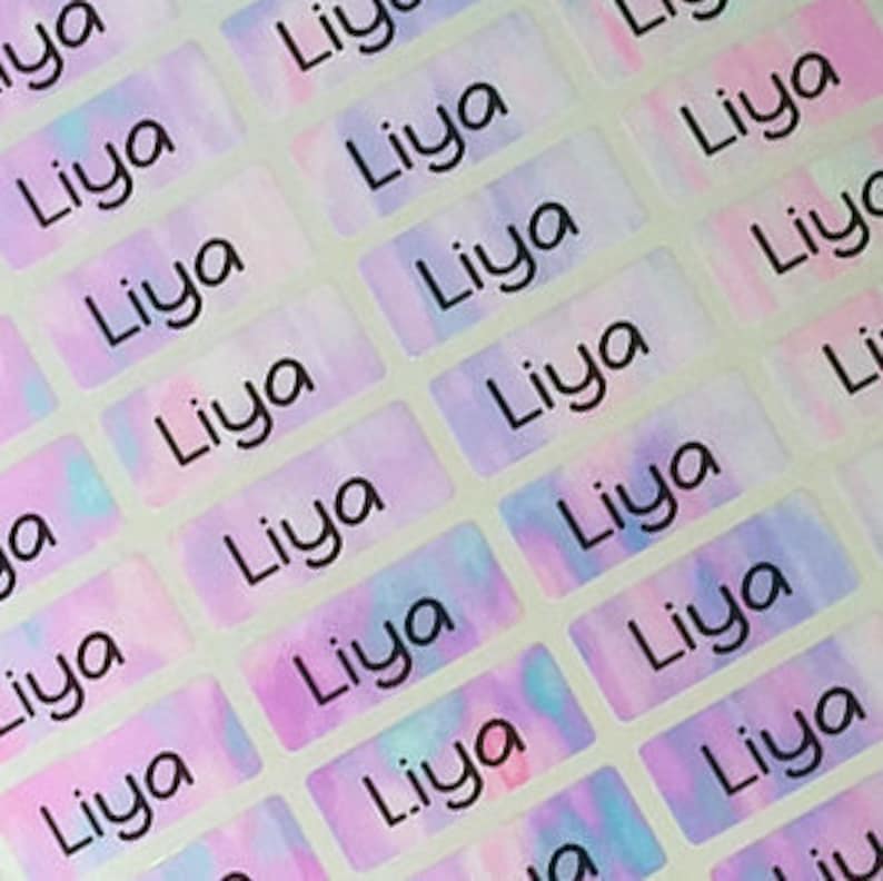 May include: A sheet of colorful, iridescent name labels with the name "Liya" printed in black on each label.