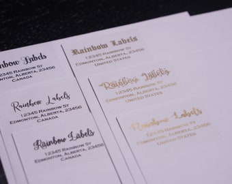 May include: Five white labels with the text "Rainbow Labels" in black and gold lettering. The labels include an address with the street name "Rainbow St", city "Edmonton", province "Alberta", and postal code "23456". The labels also indicate whether the address is in Canada or the United States.