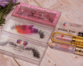 May include: Three clear plastic boxes containing false eyelashes, labeled "Uni Cool Lashes". A clear plastic tube of lip gloss labeled "Glossy Lips" and a gold and clear lip gloss pencil labeled "Uni Cool Beauty Lip Gloss".