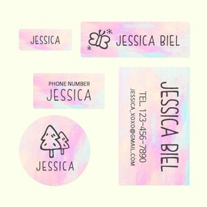 May include: Set of colorful holographic labels with a butterfly design and the name "Jessica Biel". The labels also include a phone number and email address.