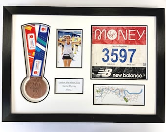 May include: A framed display of a runner's accomplishments from the London Marathon. It includes a medal, a race bib, a photo of the runner, and a map of the race route. The bib has the number 3597 and the text "WeRunTogether".