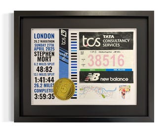 May include: A framed photo of a marathon runner's race bib and medal. The bib is pink and white with the text "TATA CONSULTANCY SERVICES" and the number "38516". The medal is gold with the number "5" on it. The photo also includes a map of the race route and the text "LONDON 26.2 MARATHON SUNDAY 27TH APRIL 2025 STEPHEN MORT 6.2 MILES SPLIT 48:82 13.1 MILES SPLIT 1:41:44 26.2 MILES COMPLETEL 3:59:35".