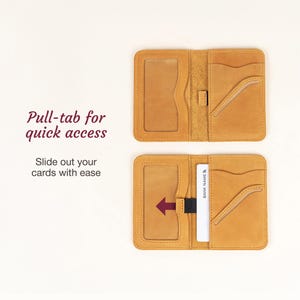 May include: Open, tan leather wallet with multiple card slots and a clear ID window. The wallet features a pull-tab for quick access and the text "Pull-tab for quick access" and "Slide out your cards with ease".