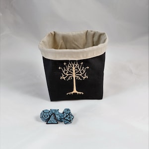 Reversible drawstring dice bag with toggle closure and square base. Ideal for D&D, board games, wargames. Features embroidered design and plain color side. Great gift for tabletop gamers