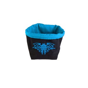 Arkham Horror Monster Cup, Reversible drawstring dice bag with toggle closure and square base. Ideal for D&D, board games, wargames. Features embroidered design and plain color side. Great gift for tabletop gamers