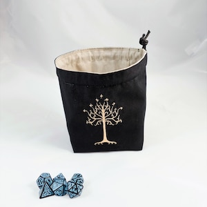 Reversible drawstring dice bag with toggle closure and square base. Ideal for D&D, board games, wargames. Features embroidered design and plain color side. Great gift for tabletop gamers