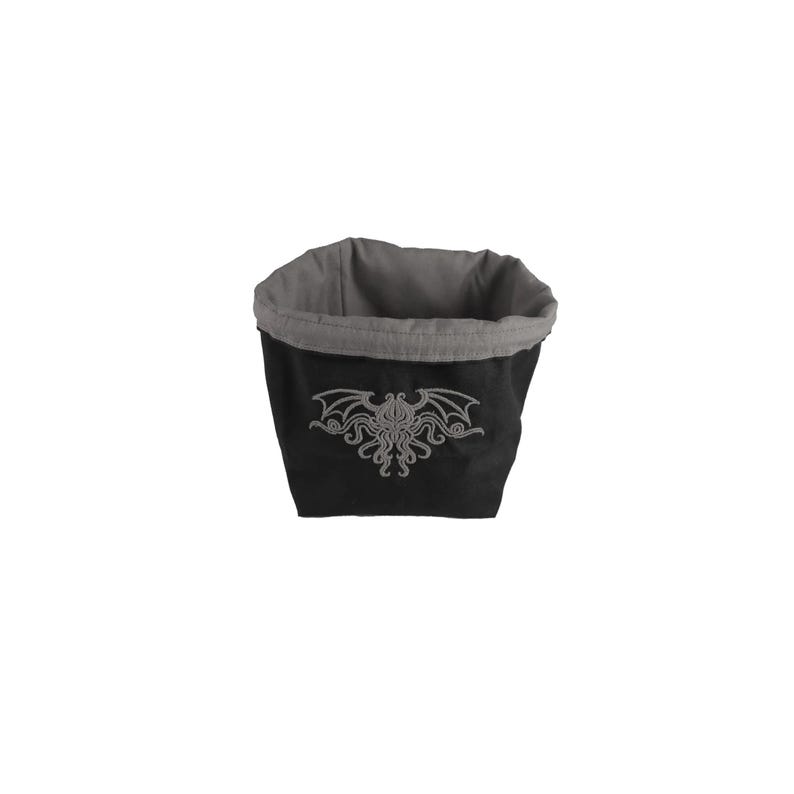 Arkham Horror Monster Cup, Reversible drawstring dice bag with toggle closure and square base. Ideal for D&D, board games, wargames. Features embroidered design and plain color side. Great gift for tabletop gamers