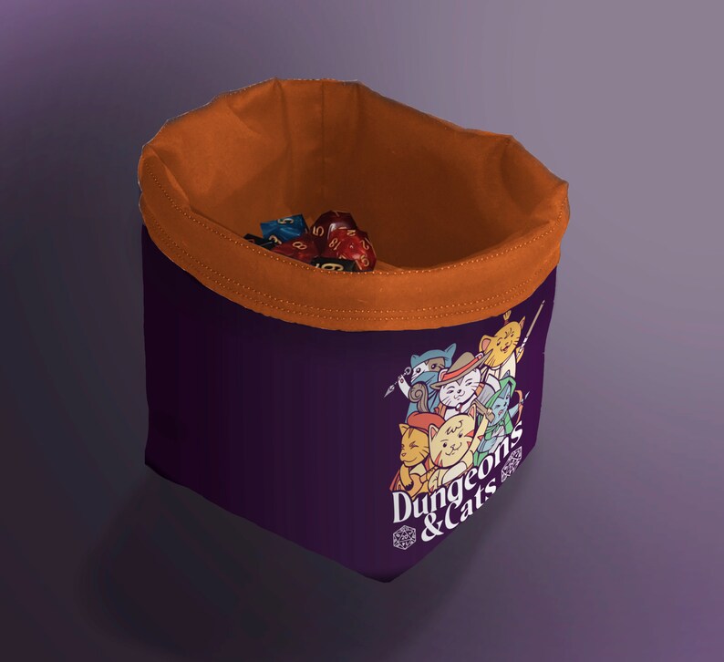 orange Cat Dice Bag for DND – Gift for Gamers and Cat Lovers!
Bring a touch of feline charm to your next Dungeons & Dragons session with this handcrafted Cat Dice Bag, featuring a whimsical Dungeons and Cats tile pattern.
🧵 Soft, durable cotton blend exterior with a secure drawstring closure
🎁 Great gift for D&D players, cat lovers, and geeky gamers
🖐️ Handmade with care in the UK
Makes a quirky stocking stuffer, birthday gift, or surprise treat for your party’s bard, rogue, or dungeon master