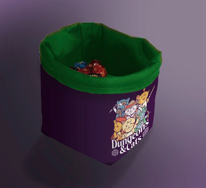 Green Cat Dice Bag for DND – Gift for Gamers and Cat Lovers!
Bring a touch of feline charm to your next Dungeons & Dragons session with this handcrafted Cat Dice Bag, featuring a whimsical Dungeons and Cats tile pattern.
🧵 Soft, durable cotton blend exterior with a secure drawstring closure
🎁 Great gift for D&D players, cat lovers, and geeky gamers
🖐️ Handmade with care in the UK
Makes a quirky stocking stuffer, birthday gift, or surprise treat for your party’s bard, rogue, or dungeon master.