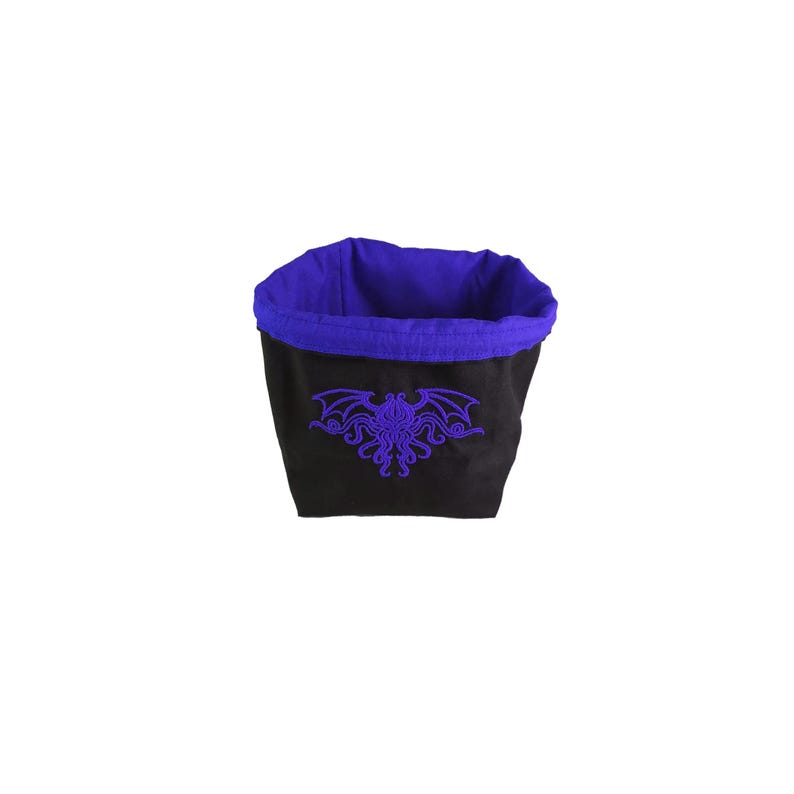 Arkham Horror Monster Cup, Reversible drawstring dice bag with toggle closure and square base. Ideal for D&D, board games, wargames. Features embroidered design and plain color side. Great gift for tabletop gamers