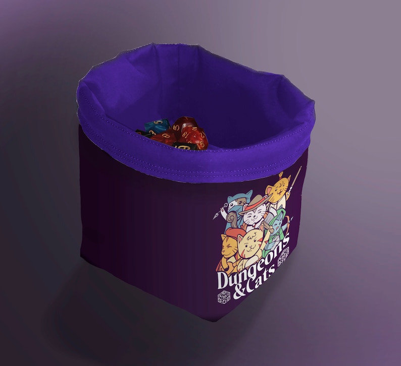Purple Cat Dice Bag for DND – Gift for Gamers and Cat Lovers!
Bring a touch of feline charm to your next Dungeons & Dragons session with this handcrafted Cat Dice Bag, featuring a whimsical Dungeons and Cats tile pattern.
🧵 Soft, durable cotton blend exterior with a secure drawstring closure
🎁 Great gift for D&D players, cat lovers, and geeky gamers
🖐️ Handmade with care in the UK
Makes a quirky stocking stuffer, birthday gift, or surprise treat for your party’s bard, rogue, or dungeon master