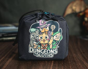 May include: A black drawstring bag featuring a graphic of cartoon sloths dressed as Dungeons and Dragons characters. The bag reads "Dungeons & Sloths" in white text.