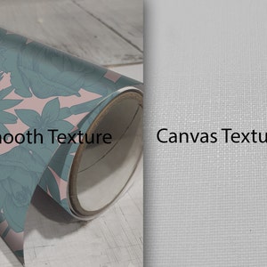 May include: A close-up of two rolled up canvases. The canvas on the left has a smooth texture and a floral pattern in pink and teal. The canvas on the right has a canvas texture and is white. The text "Smooth Texture" is printed on the left canvas and "Canvas Texture" is printed on the right canvas.