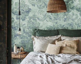 May include: A white bed with a green headboard and a woven wicker pendant light hanging above it. The wall behind the bed is covered in a green and blue floral wallpaper.