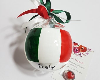 Ball with Italian flag, ornament of Italy. National flags themed Christmas tree, personalized sphere with banner and dedication.