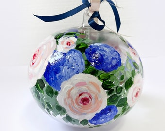 Large glass ball hand decorated with mixed flowers. Original artwork painted with blue hydrangeas and pink roses. Prestigious gift.