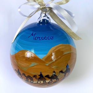 Morocco Christmas ornament, desert with camels and tent, souvenir adventure trip, Marrakech Sahara desert, magnificent oasis tour.