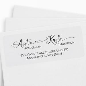 May include: White address labels with black script text. The labels feature the names "Austin" and "Kayla" in elegant cursive, along with the address "2560 West Lake Street, Unit 310, Minneapolis, MN 55408".