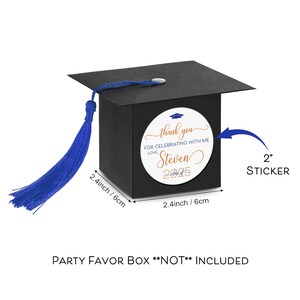 May include: A black graduation cap shaped favor box with a blue tassel. A 2 inch round sticker with the text "thank you for celebrating with me love Steven Class of 2025" is attached to the box.