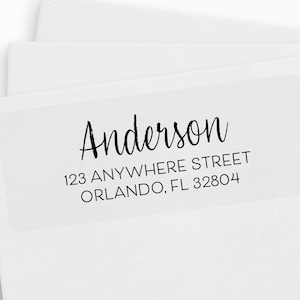 May include: White return address label with black text. The text reads "Anderson", "123 Anywhere Street", "Orlando, FL 32804".