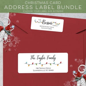 May include: Two Christmas address labels with a string of colorful lights and the text "The Bessar Family" and "The Tayler Family" with their addresses.