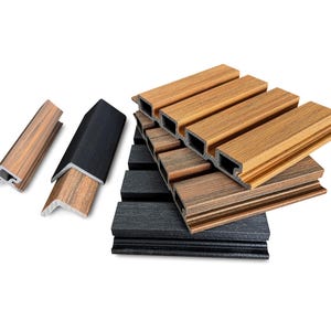 May include: Assortment of wood-look trim pieces in various shades of brown and black. The pieces are rectangular with a grooved design and are stacked and arranged to showcase their different colors and textures. Ideal for home improvement projects.