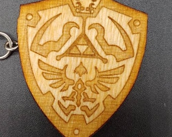 Porte-clés sur le thème de The Legend of Zelda, découpés au laser et gravés sur bois