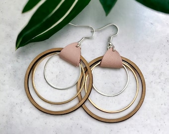 Large Wooden Hoop Earrings with graduating Silver and Gold Hoops and a Soft Pink Leather