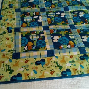 Child&#39;s Quilt With Colorful animals