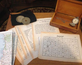 May include: A vintage-style game set with a map, a compass, and a pocket watch. The game is called "The Angell Adventures: The Cursed Mariners".