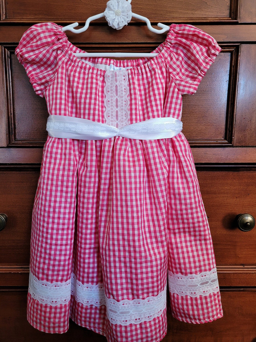 Pink gingham strappy frock with lace trim