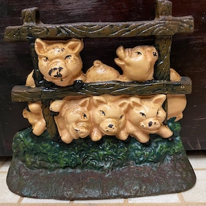 Vintage Cast Iron Door Stop Pigs Behind Fence