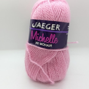 May include: A pink ball of Jaeger Michelle yarn with mohair. The label reads "Jaeger Michelle with Mohair".