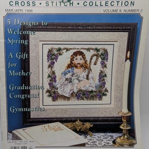 May include: Stoney Creek Cross Stitch Collection magazine cover featuring a cross stitch design of "The Good Shepherd". The design depicts Jesus holding a lamb with a staff and a vine with grapes in the background. The magazine is volume 8, number 2 and is dated March/April 1996.