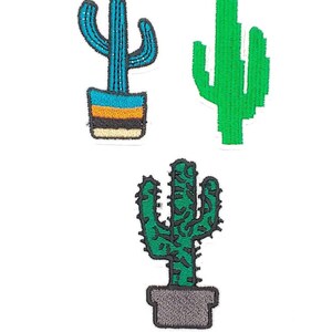 May include: Three iron-on cactus patches. One cactus is blue with a yellow and orange pot. One cactus is green with a grey pot. One cactus is green with no pot.