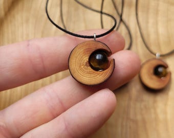 Natural moon necklace made from pine wood with brown tiger's eye gemstone - handmade, vegan and sustainable