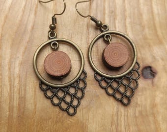 Beautiful earrings made of pine wood, rock crystal and brass elements