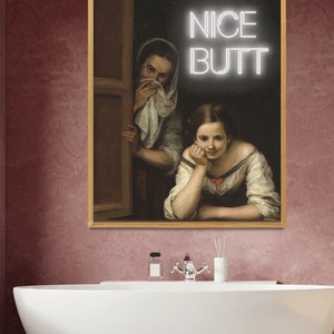 May include: A framed painting of two women in a window, with the text "NICE BUTT" in neon letters above them.