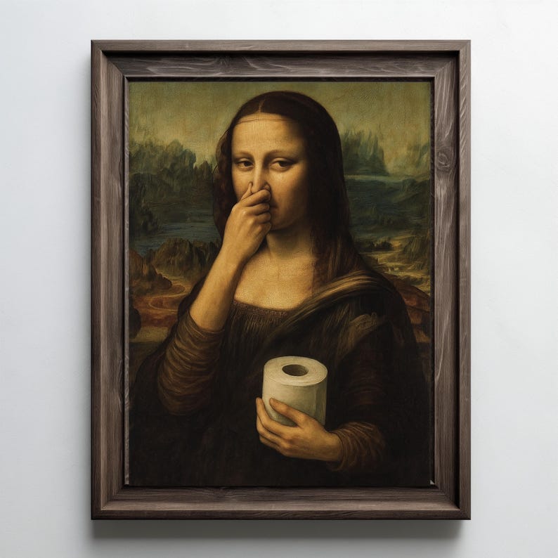 May include: A framed print of the Mona Lisa holding a roll of toilet paper and pinching her nose. The artwork is a parody of the original painting, with a dark brown wooden frame.