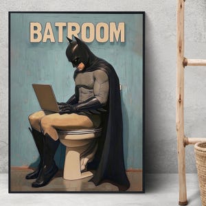 May include: A humorous illustration of Batman sitting on a toilet, wearing his iconic cape and cowl, while using a laptop. The text "BATROOM" is displayed above him.
