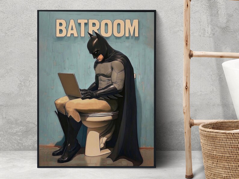 May include: A humorous illustration of Batman sitting on a toilet, wearing his iconic cape and cowl, while using a laptop. The text "BATROOM" is displayed above him.