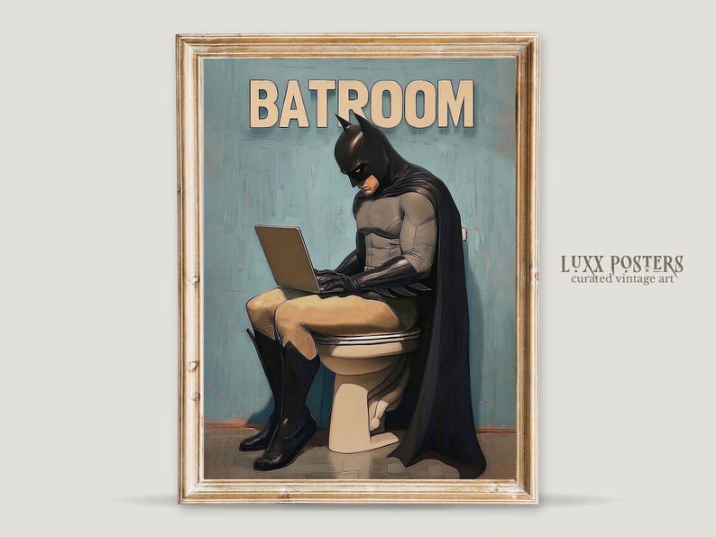 May include: A vintage-style poster with a humorous illustration of Batman sitting on a toilet, wearing his iconic costume and cape, while using a laptop. The poster has a blue background and the text "BATROOM" in bold, white letters.