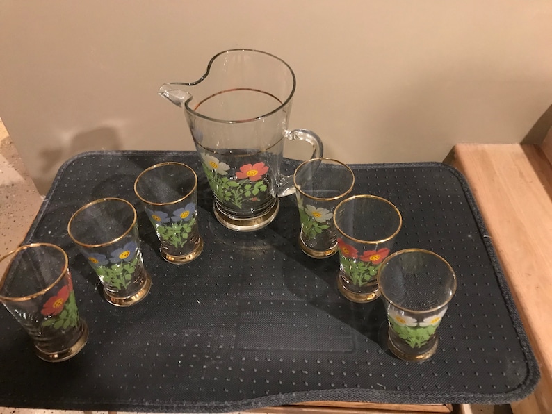 Beautiful Vintage Flowered Glass Pitcher with 6 glasses gold trim on top and bottom of glasses