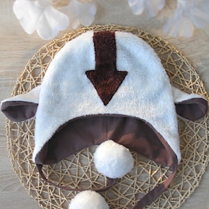 Faux Fur Bison Hat: White Fluffy Winter Cap with Brown Arrow