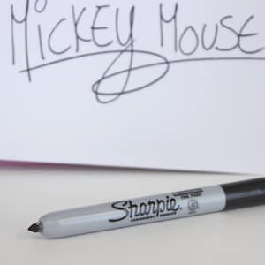 Add a Retractable Black Sharpie Permanent Marker Fine Point to Autograph Book Orders