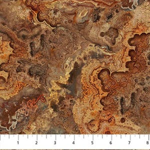 May include: A close-up of a fabric with a natural stone pattern. The design features swirling patterns in shades of brown, tan, and rust, resembling agate or other geological formations. The fabric has a textured appearance.