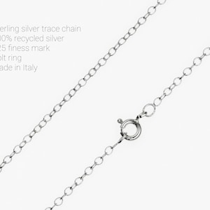 May include: A sterling silver trace chain with a bolt ring clasp. The chain is made of 100% recycled silver and has a 925 fineness mark. The text on the image says "Made in Italy".